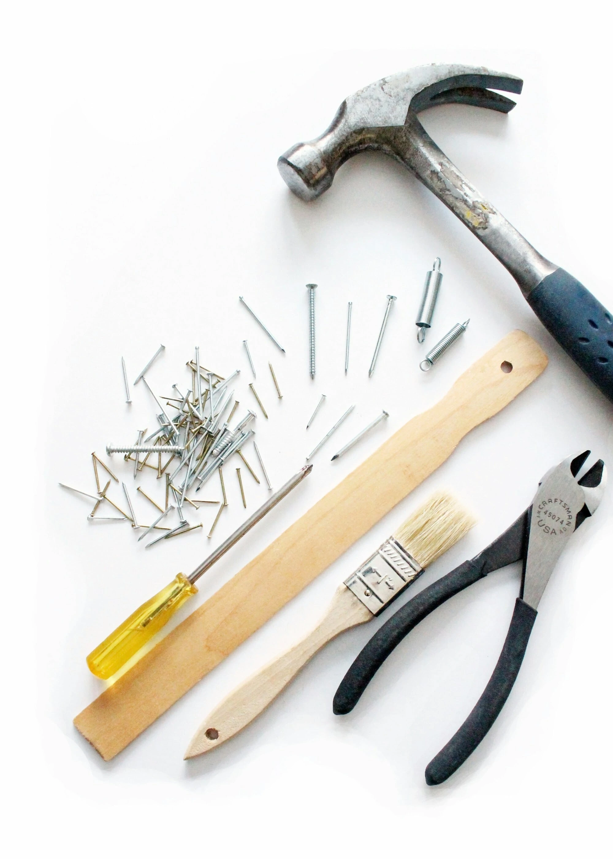 Tools and Nails on white bench