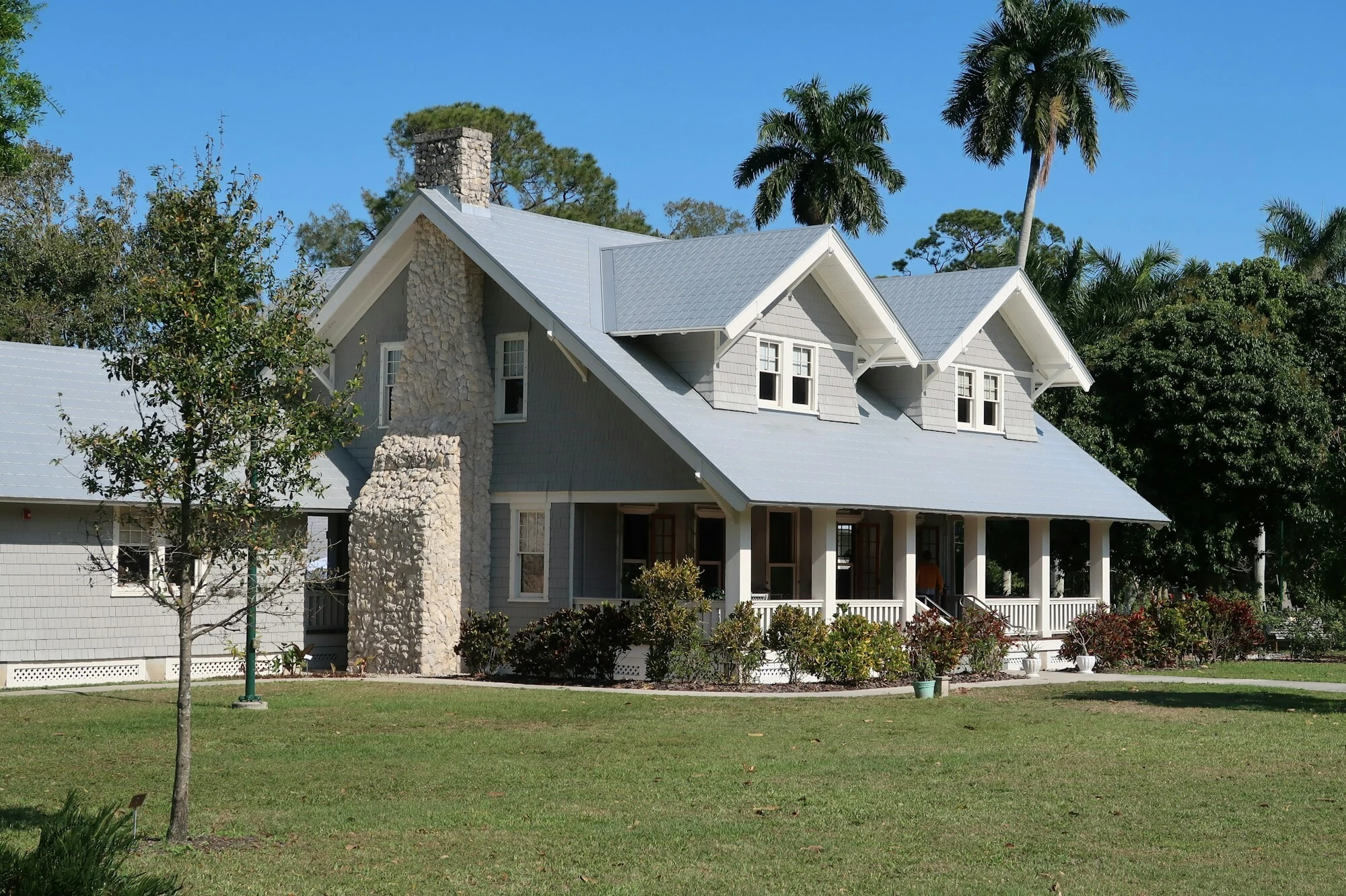 Nice home, grey exterior with a well looked after garden.